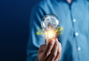 man holding lightbulb